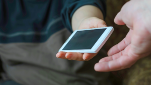 handing-phone-over-deal